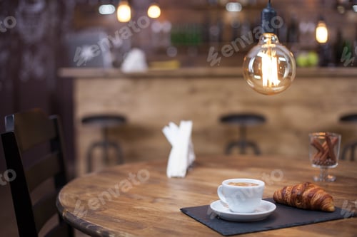 Preview: Close up of delicious cup of coffee with parisian dessert