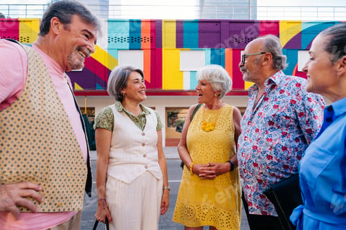 Preview: Group of senior friends meeting outddors in the city and having fun
