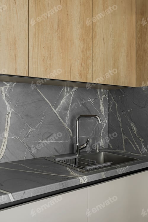 Preview: Grey table top, stainless steel sink with water tap, grey wall, minimalistic kitchen cabinets