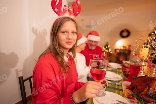 Preview: Portrait of girl standing with smile wearing Chrismas jumper.