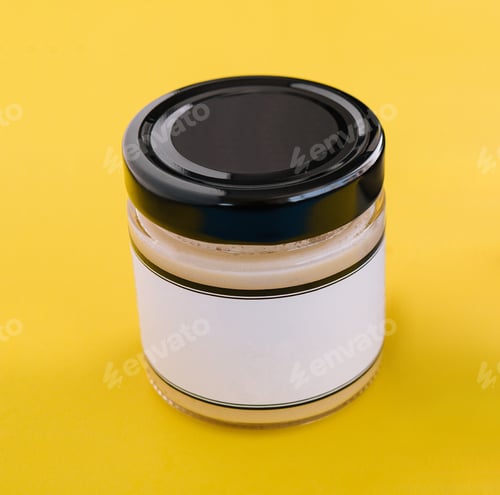 Preview: salad dressings in glass jar on yellow background