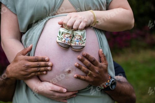 Preview: Baby bump pregnancy maternity hands details outdoors gardens Kenya