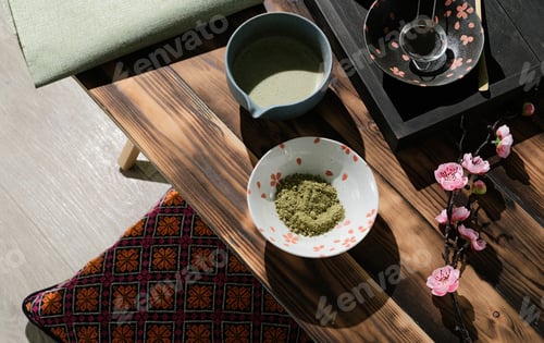Preview: Green matcha powder and tea and whisk and spoon for preparation