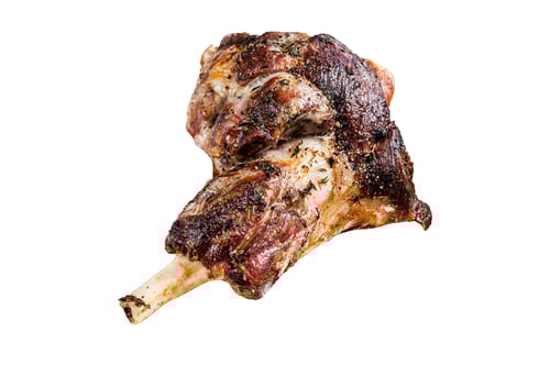 Preview: Roasted lamb mutton whole leg in a baking dish. Isolated, white background.