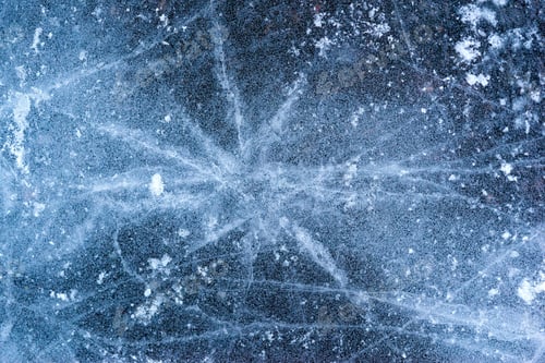 Preview: Abstract Texture Of Frozen Water Or Ice With Cracks Closeup For A Background Or For Wallpaper