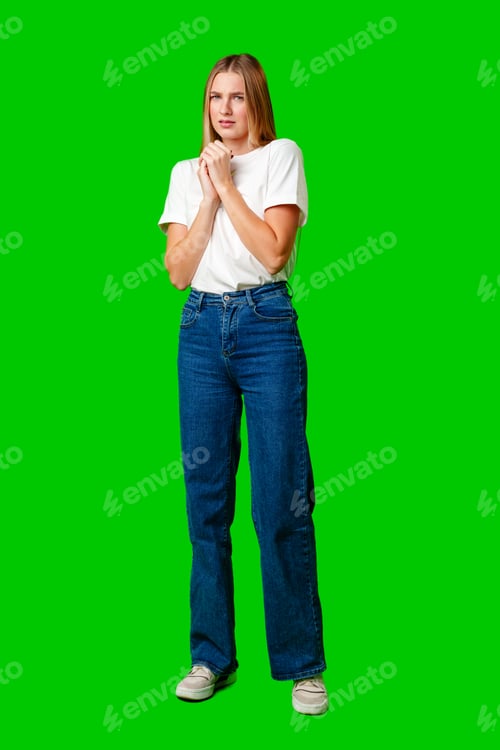 Preview: Young Woman With Pursed Lips Expressing Skepticism Against Green Screen Background