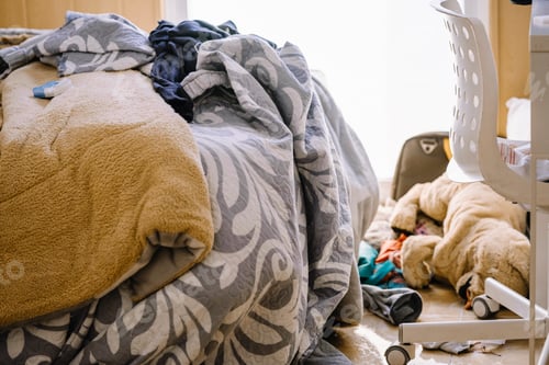 Preview: Messy teen room with clothes lying on the floor.