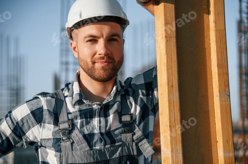 Preview: Confident worker. Man is on the construction site at daytime