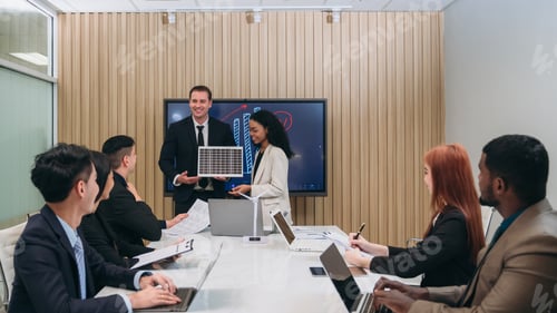Preview: Businesspeople discussing during meeting in conference room. Clean Energy Discussions.