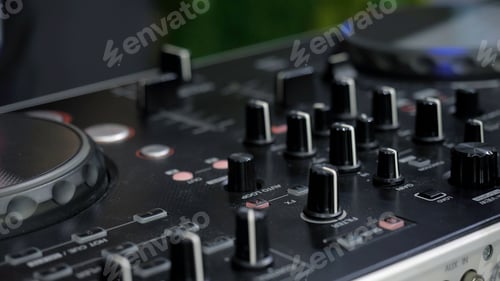 Preview: Man in sound studio working with sound mixer console. Media. DJ hands and sound machine, music