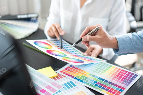 Preview: Two creative graphic designer team working on color selection an