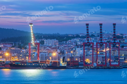 Preview: View of Lisbon port with ship and port cranes in the evening