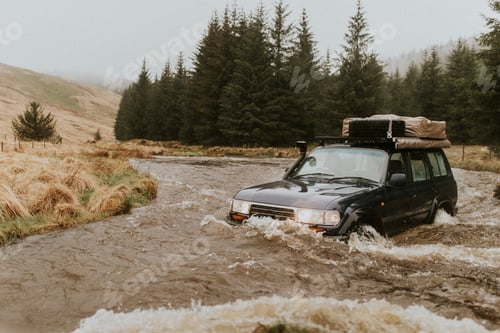 Preview: Car stuck in a stream waiting for rescue