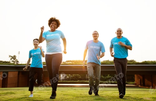 Preview: Enthusiastic Volunteers Running on Grassy Urban Rooftop