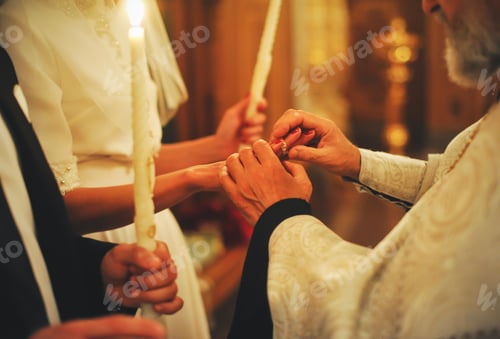 Preview: The priest puts on the ring at the wedding ceremony in the church