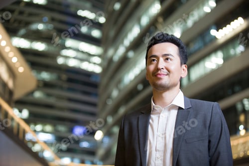 Preview: Businessman looking at view