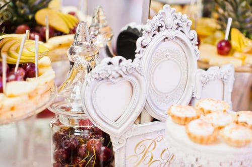 Preview: Wedding reception table with different fruits, cakes and sweets.