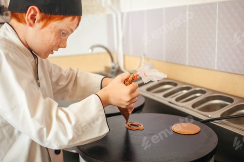 Preview: red-haired boy in chef's costume