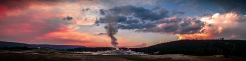 Preview: Panoramic view of Old Faithful Geyser at colorful sunset in Yellowstone National Park, Wyoming