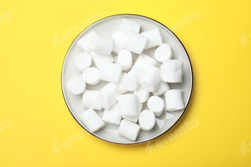 Preview: Delicious puffy marshmallows on yellow background, top view