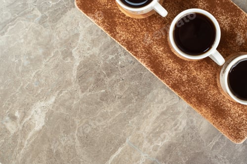 Preview: Three cups of espresso on wooden board