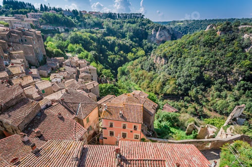 Preview: View of the red roofs and green valley in Sorano , Italy
