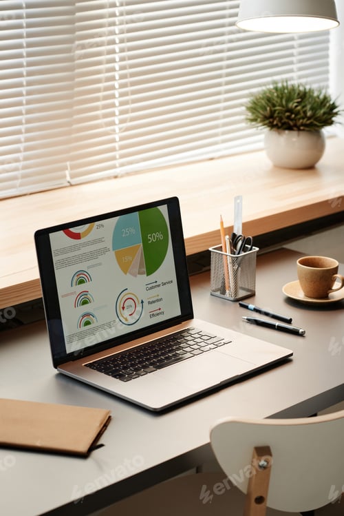Preview: Laptop with financial graphs on the screen
