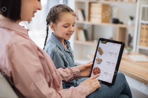 Preview: Smiling online shoppers buying fast food over digital device