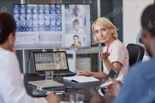 Preview: Female Neurologist Mediating Online Meeting Discussion Talking to Colleagues at Medical Office