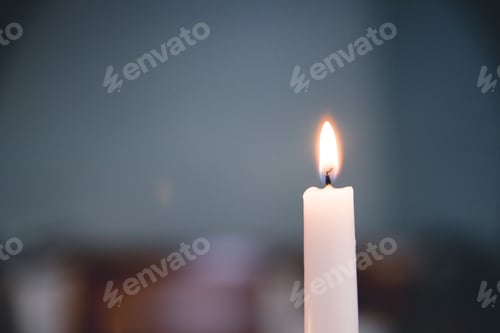 Preview: Selective focus closeup shot of lighted white candle