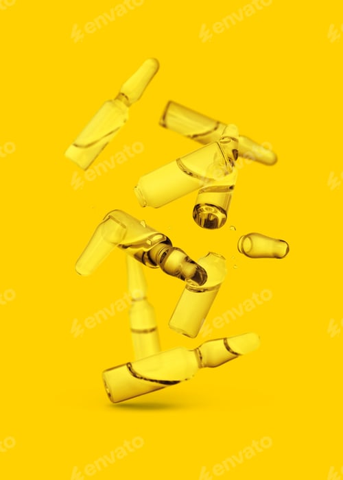 Preview: Many ampoules and glass pieces falling on yellow background