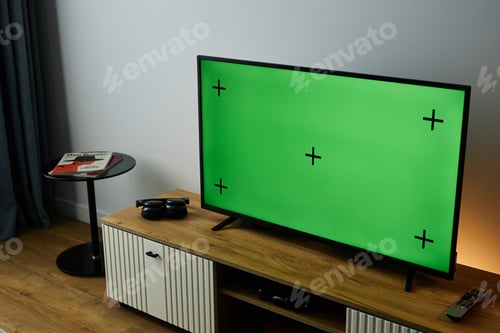 Preview: at Angle Big TV with Green Screen Mock Up on TV Stand