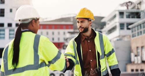 Preview: Architecture, man and woman on building shaking hands for inspection, agreement or introduction in