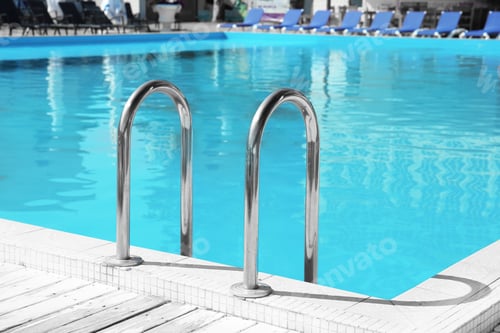 Preview: Modern swimming pool with step ladder outdoors