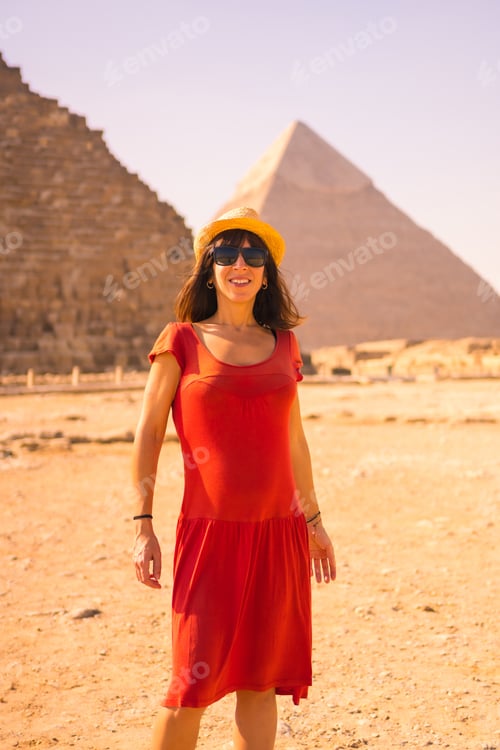 Preview: Portrait Of A Young Girl In Red Dress At The Pyramid Of Cheops The Largest Pyramid. The Pyramids Of