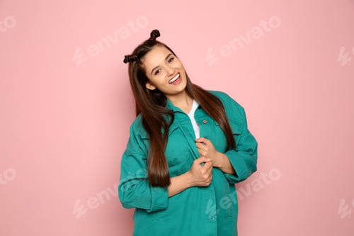 Preview: Portrait of beautiful young woman in stylish clothes on color background