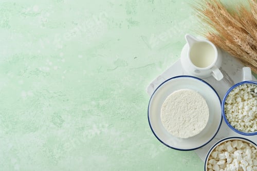 Preview: Shavuot jewish holiday celebration. Kosher fresh dairy products milk and cheese, ripe wheat, cream o