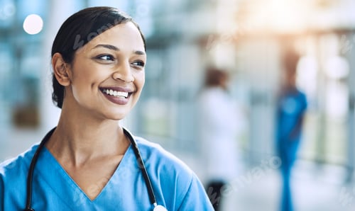 Preview: Smiling Woman in Scrubs at the Hospital