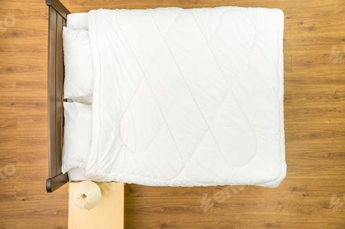 Preview: The bed with a white linens. View from above.