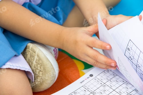 Preview: Little girl doing her homework