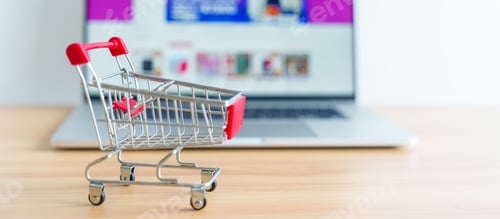 Preview: Shopping cart and laptop computer with marketplace website.
