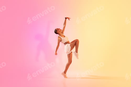 Preview: An exuberant young dancer in a dynamic pose captures the essence of movement and grace