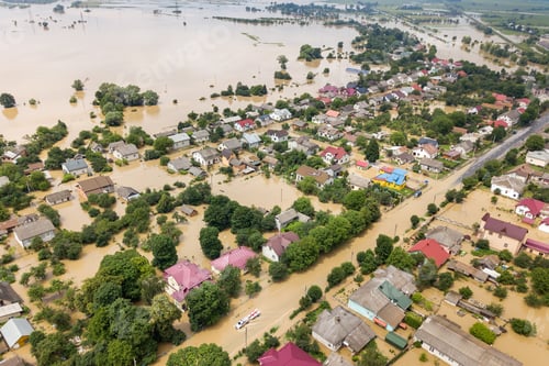 Preview: Aerial view of flooded houses with dirty water of Dnister river in Halych town, western Ukraine