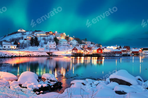 Preview: Dramatic evening cityscape of Reine town with Northern Lights.