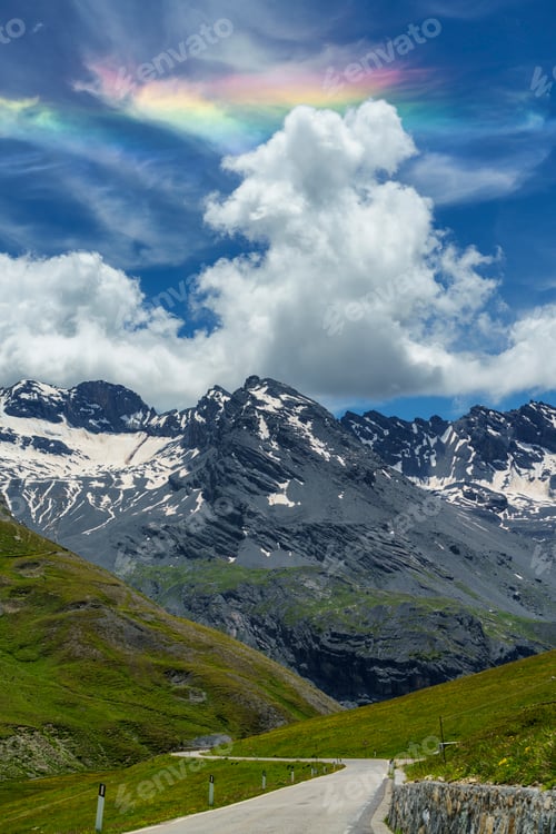 Preview: Iridescent cloud over the road to Stelvio pass (Lombardy) at summer
