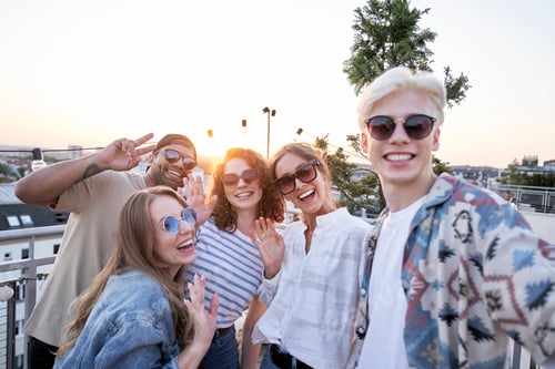 Preview: Group of friends have video call from rooftop party