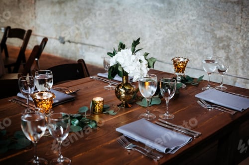 Preview: dinner table setup and decorated for a wedding