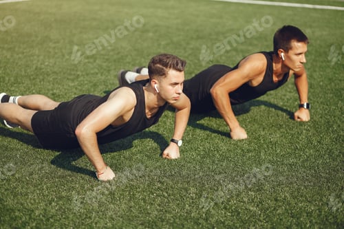 Preview: Handsome man training in a summer park