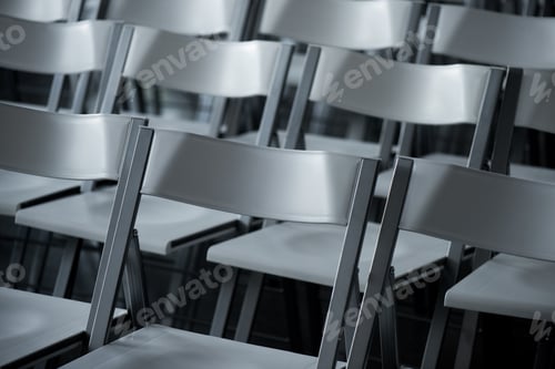 Preview: close up view of arranged empty modern chairs