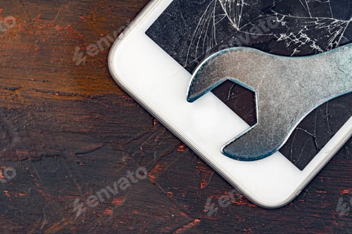 Preview: Smartphone repair concept. Damaged display of smartphone and tools